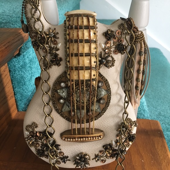 Mary Frances Handbags - Guitar purse by Mary frances new no damage.